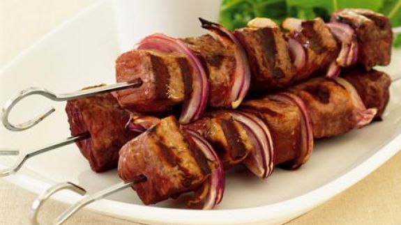 Skewered beef with olives