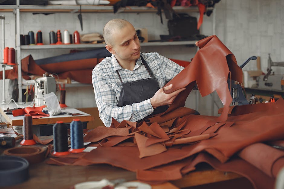 An image of a person performing quality assurance checks on a product in a manufacturing facility.